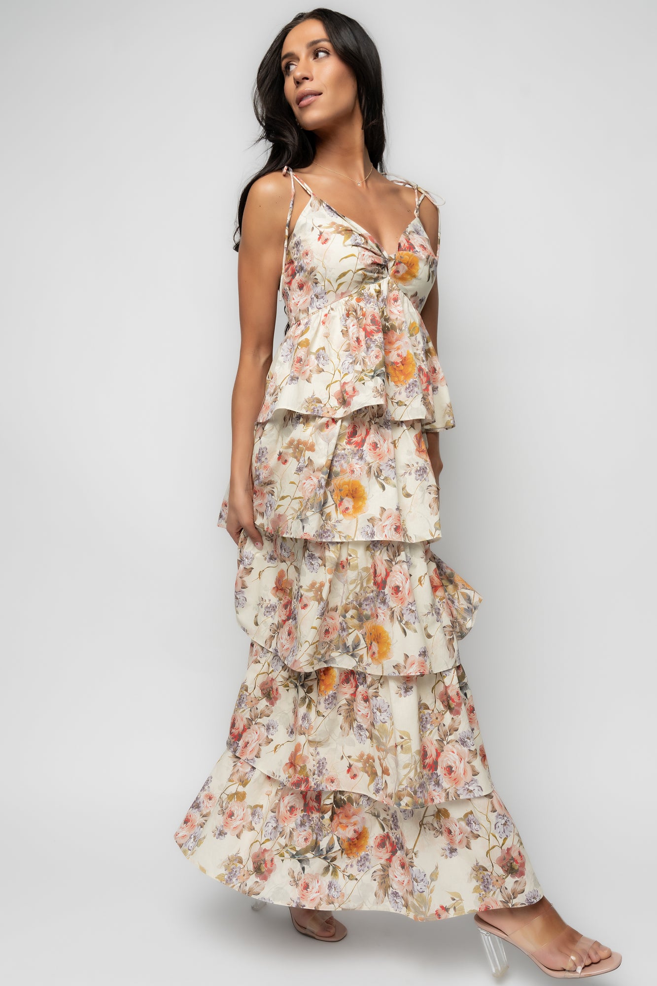 Flat-lay of Angelica Tiered Maxi Dress showcasing the V-neck twist, adjustable tie straps, smocked back, and four-tiered skirt on a buttercream base.