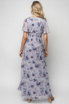 Detail image of short flutter sleeve and pleating on the bust, showing the soft sheen and stretch composition of the mesh fabric.