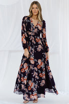 Side view of Adira maxi dress showing left leg slit, flowing maxi skirt, and how the lined skirt moves with each step for graceful motion.