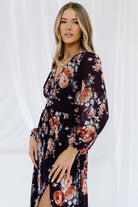 Detail image of long airy bishop sleeve with elastic cuff on plum floral Adira dress, highlighting soft volume and sleeve construction.