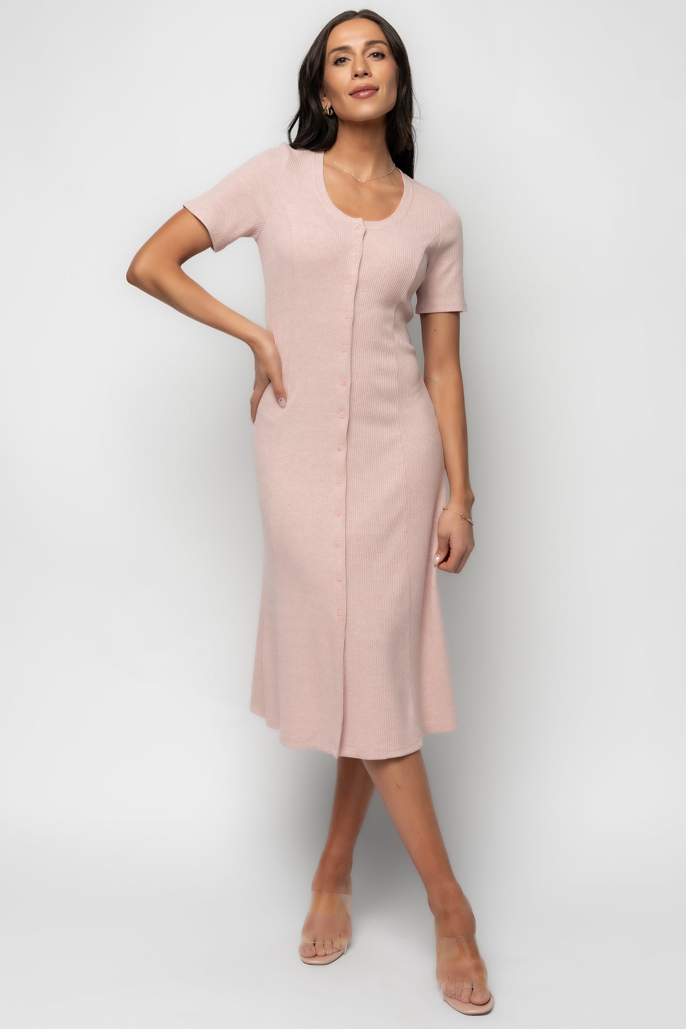 Three-quarter view of Océane Midi Dress in blush on model, highlighting short sleeves, fitted bodice, and mid-length hem.
