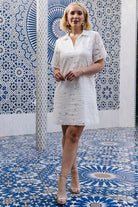 Back and side view of Calida Lace Dress on model, revealing short sheer sleeves, shift fit and gentle movement of lace.