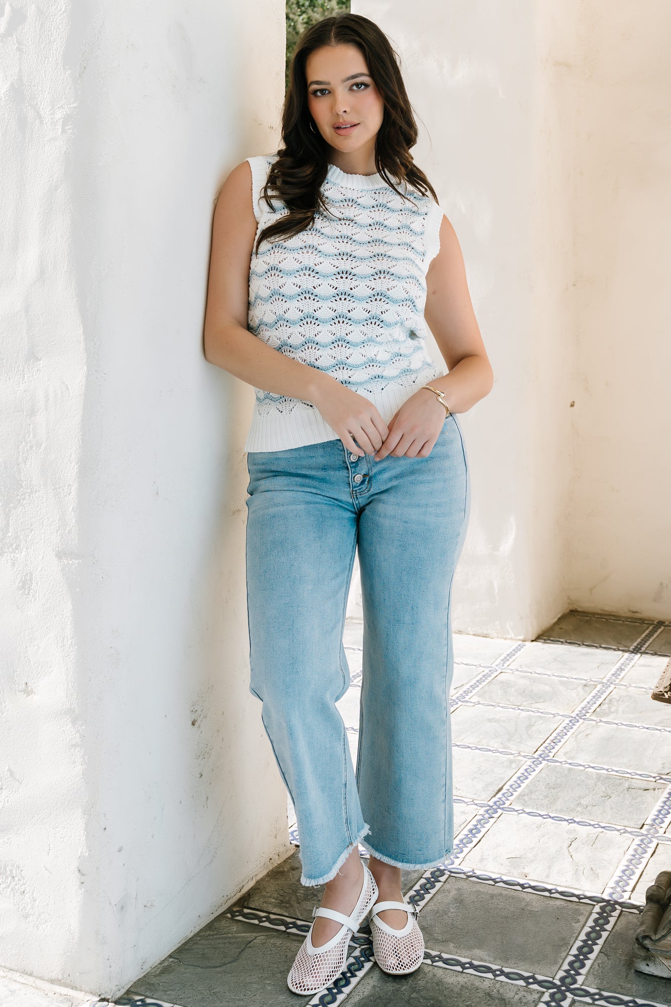 Detail image of ribbed neckline and cuff on Baeza Crochet Tank, illustrating stitch definition and fabric stretch.