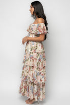 Back view of chiffon maxi dress with elastic off-shoulder neckline and fully lined skirt and bodice for comfortable coverage and shape.