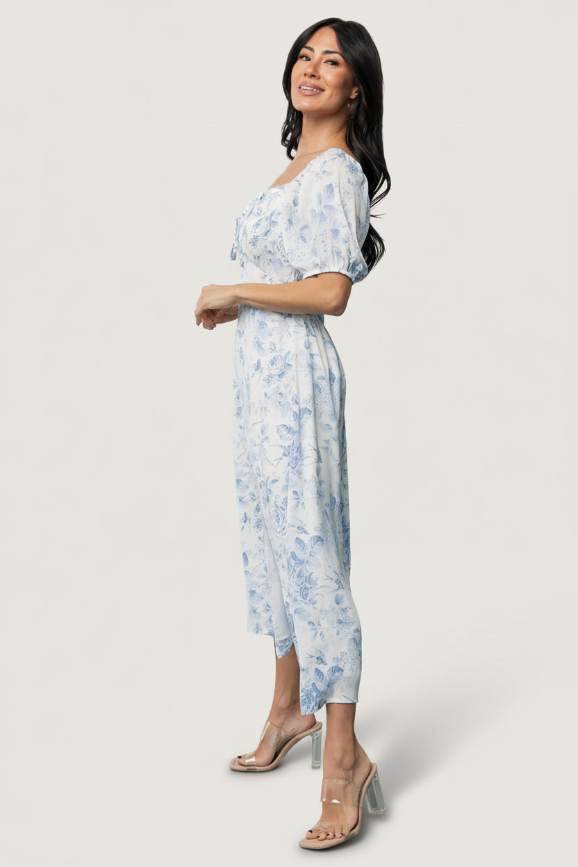 Styling image of Cadence Midi Dress paired with sandals showing fabric drape, skirt movement, and casual summer outfit suggestion.