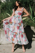 Back view of Anita Maxi Dress showing smocked back panel, adjustable ties, and full coverage lining at the skirt.