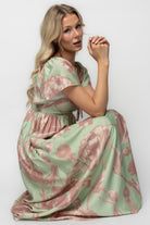 Studio flat-lay of the Eliana Maxi Dress displaying the overall floral pattern, fabric drape, and fully lined body construction with unlined sleeves.