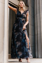 Detail shot of floral print and fabric drape on the Adelyn Maxi Dress showing the tulle overlay and smooth polyester lining.