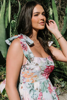 Full-length shot of the Anita Maxi Dress on a model highlighting the light blue floral print and flowing silhouette.