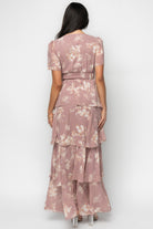 Detail view of short, flowy sleeve and chiffon fabric texture on the Montaigne Ruffle Maxi Dress in mauve floral.
