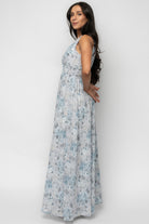 Detail image focusing on the smocked waist and hem of the Imogen Maxi Dress, showing fabric print, lining edge and stitch finish.