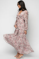 Back view: Ensley Maxi Dress in Dusty Rose Floral highlighting elastic back waist and smooth lined skirt.
