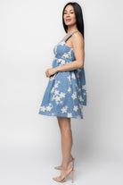 Full-length outdoor shot of model wearing the Ivy Short Dress styled with sandals, showing movement, lining, and overall length.