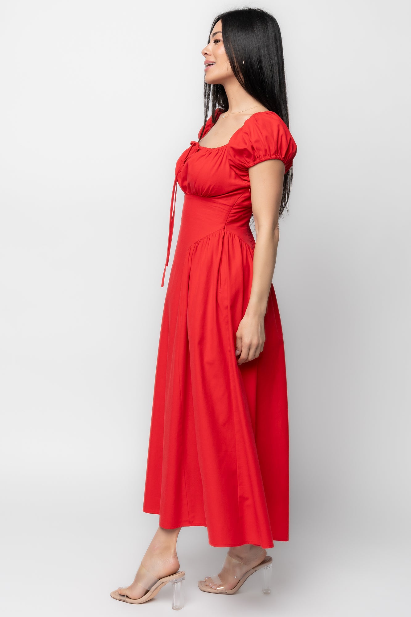 Back view of the Havana midi dress displaying the smocked back panel and the clean hidden left-side zipper closure.