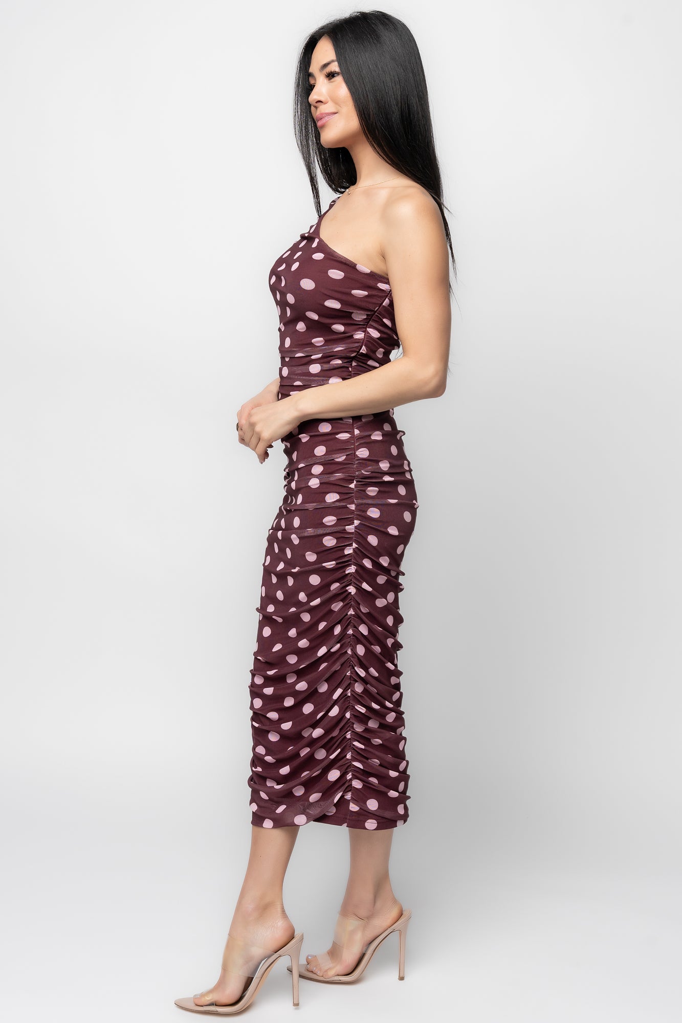 Side view highlighting the left-side zipper, ruched side seam, and smooth inner lining beneath the mesh overlay.
