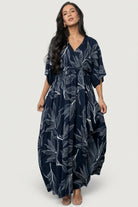 Back and hem detail of Kalea maxi dress showing natural drape of rayon skirt, mid-thigh lining edge and subtle movement at the hemline.