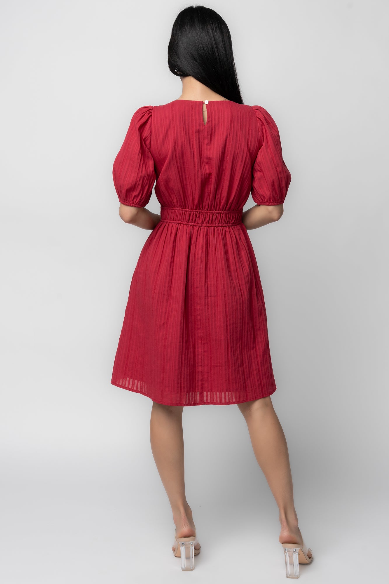 Fabric detail of dusty red Hayley Short Dress showing woven cotton texture and smooth lined interior for opacity.