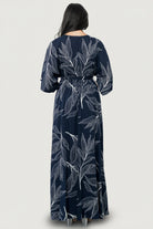 Three-quarter view of Kalea dress showcasing crossover surplice neckline, loose kimono sleeves and elastic waist with detached self-tie sash detail.
