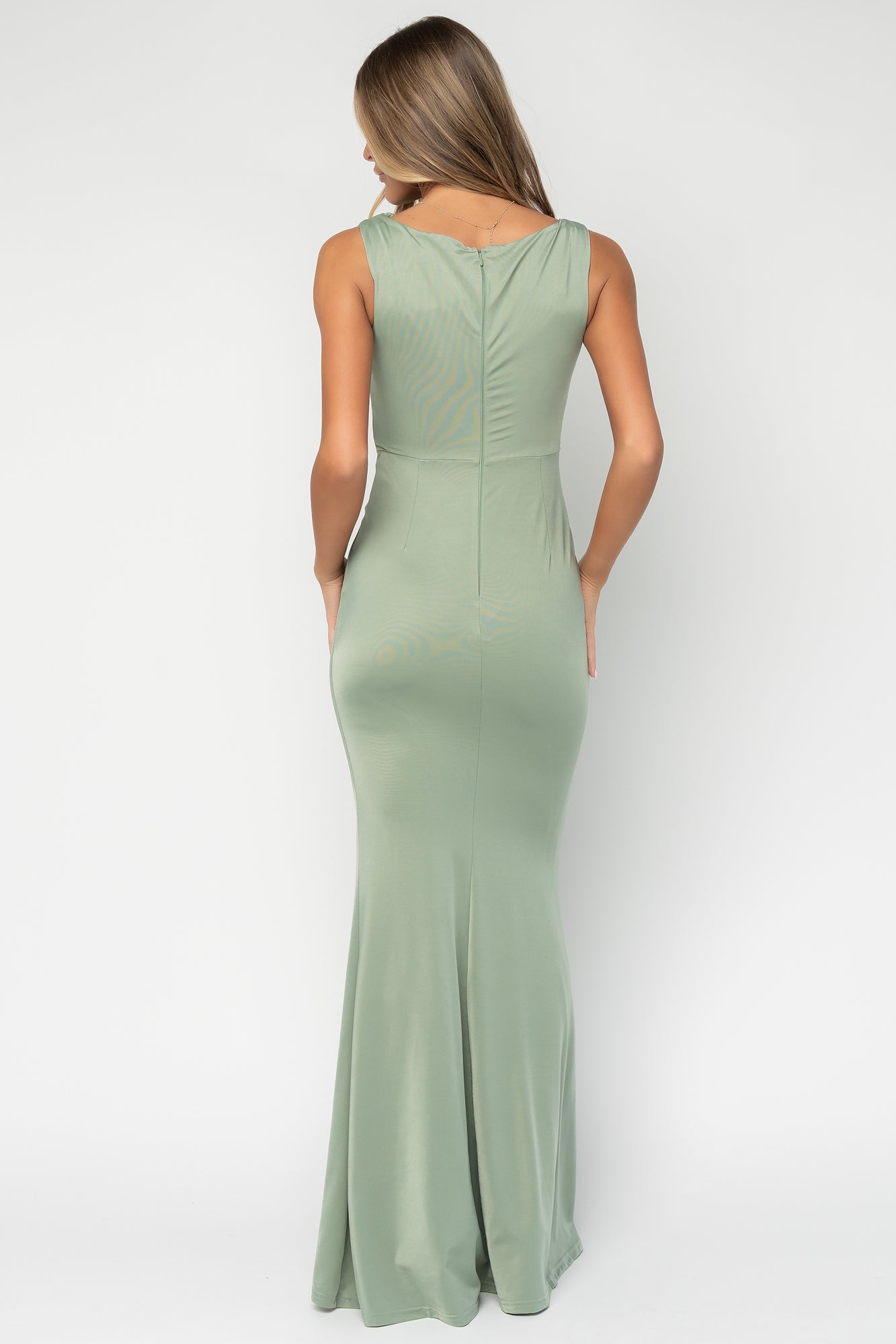 Close-up of the gold-tone oval hardware and ruched waist detail on the Avalon Maxi Dress, highlighting metal finish and fabric texture.