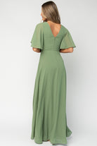 Close-up of bodice with seams and defined waist of the olive Valetta dress, displaying fine chiffon layering and tailoring.