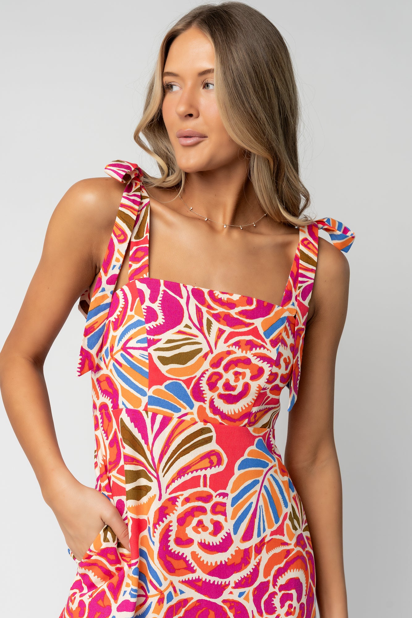 Full-length side profile of the Sydney Maxi Dress showing the single-tiered skirt, flowing drape, and hidden side pocket placement.