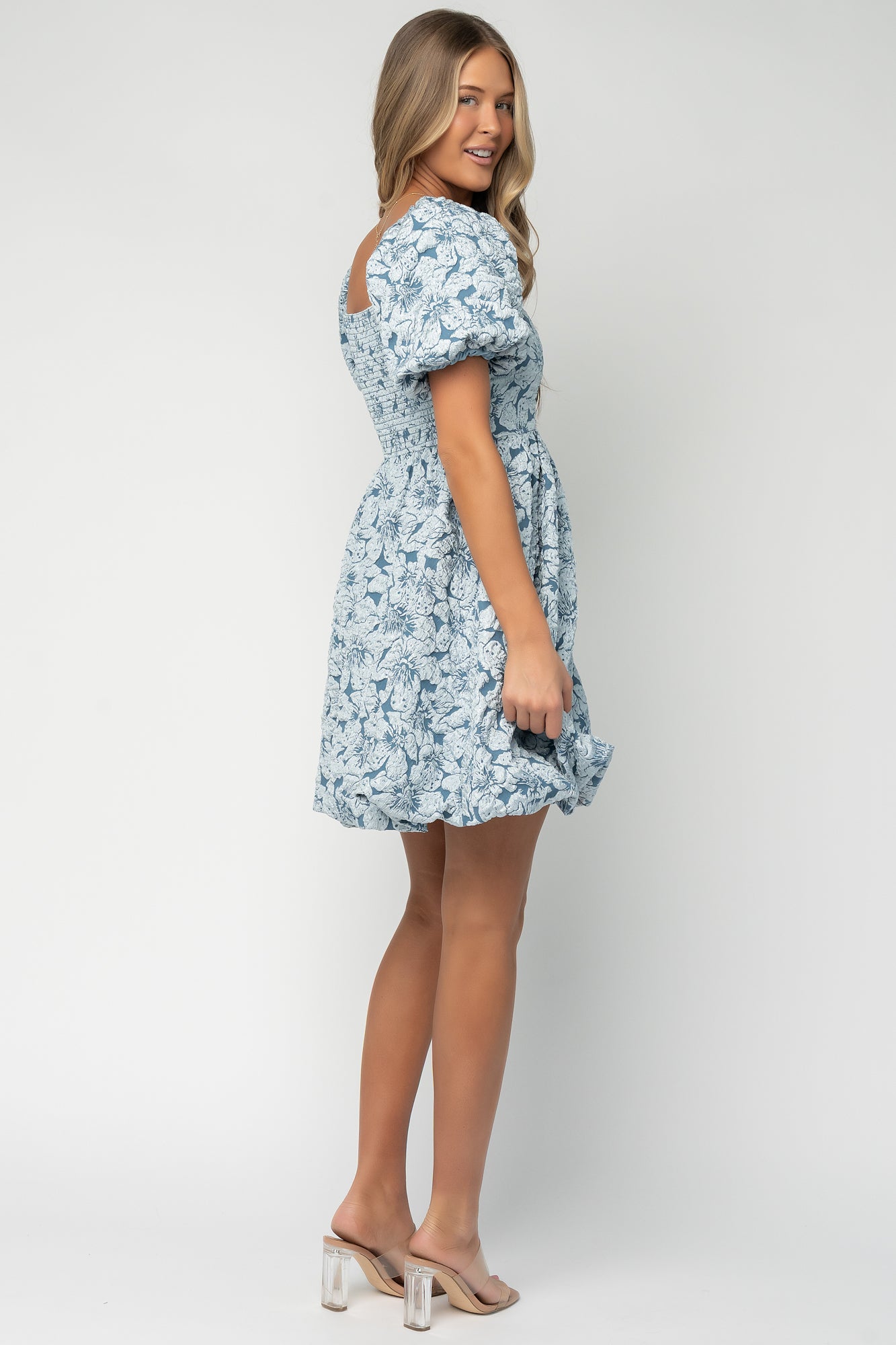 Side view of the dress emphasizing the left-side invisible zipper and smooth, fully lined interior construction for comfort.