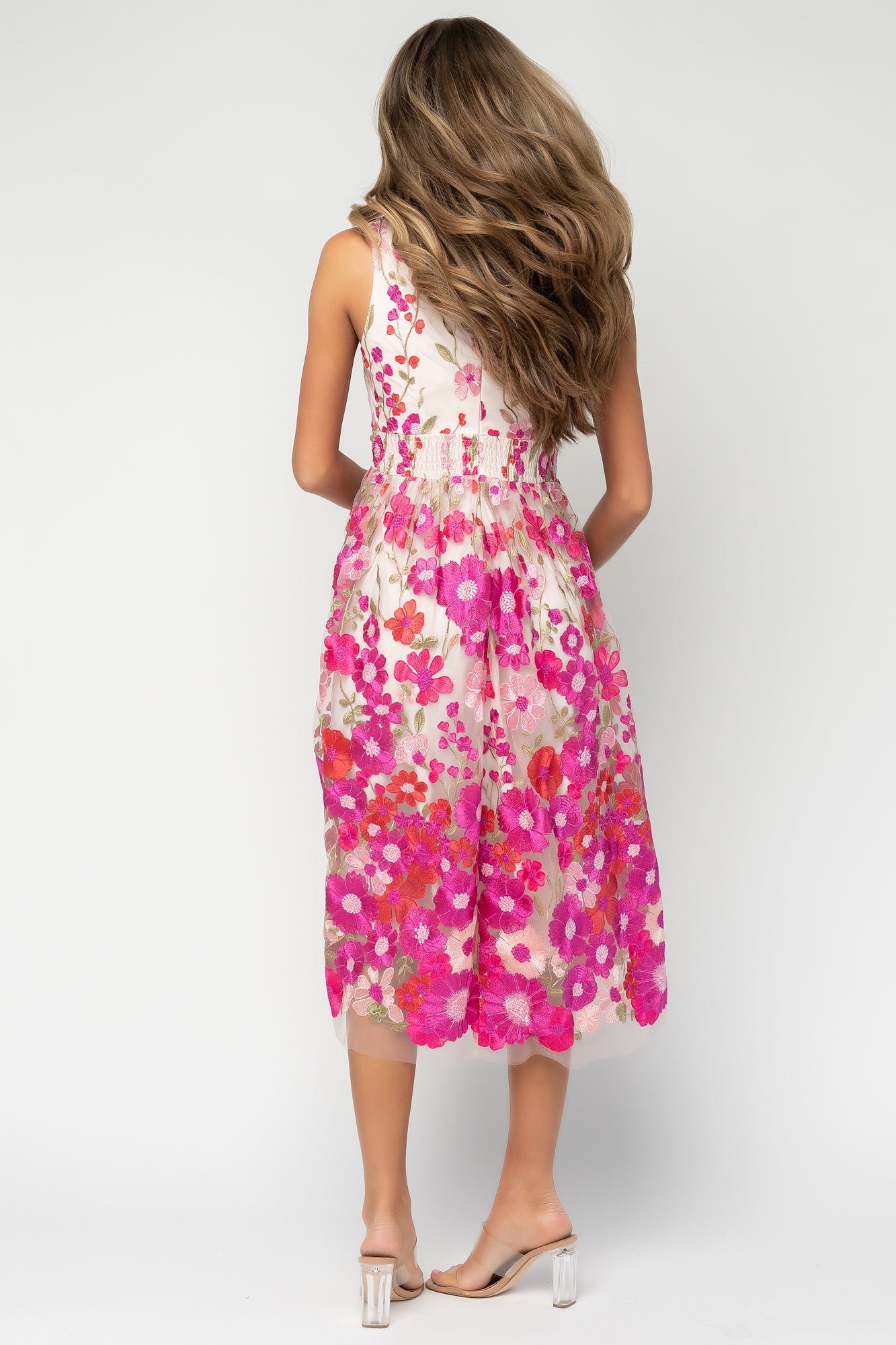 Detail shot of pleated waist and bloused bodice on the Lila midi dress, highlighting tailoring and feminine shaping around the waistline.