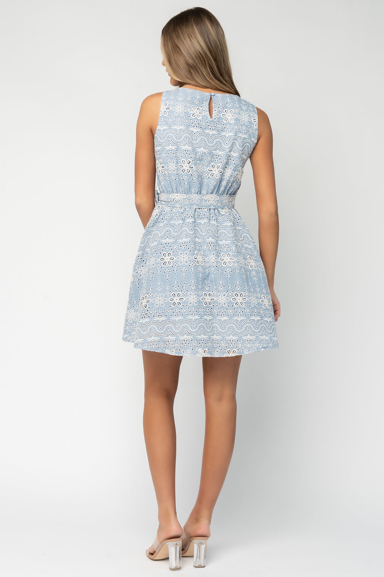 Back view of Celestia Eyelet Short Dress showing adjustable self-tie sash, tank straps, and fully lined skirt for coverage.
