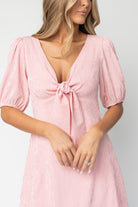 Detail shot of short puff sleeve with elastic cuff and unlined back bodice showing fabric drape and construction details.