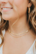 Packaging and presentation image displaying the necklace with minimal gift-ready styling, emphasizing its everyday elegance and versatility.