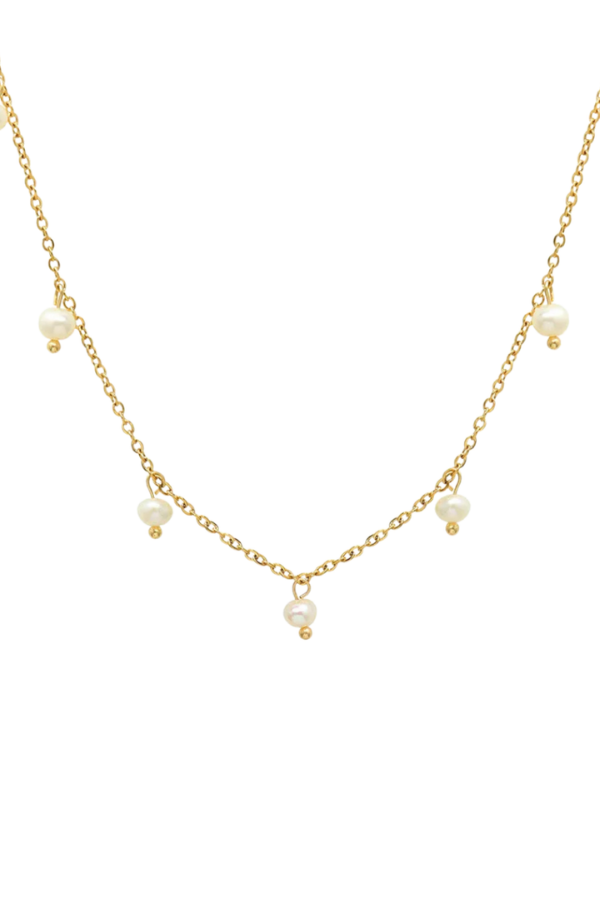 Styled flat-lay of Rosie Pearl Necklace showcasing the adjustable clasp, fine gold links, and petite pearls arranged for scale and composition.