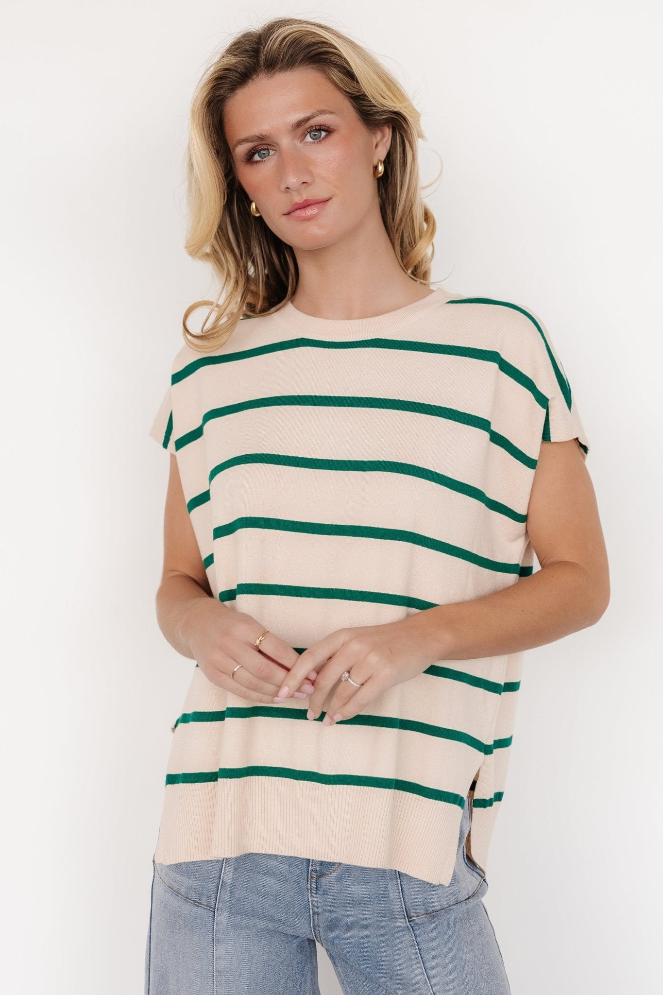 Back and side view of natural striped dolman top highlighting the split side hem, relaxed silhouette, and ribbed hem finish.