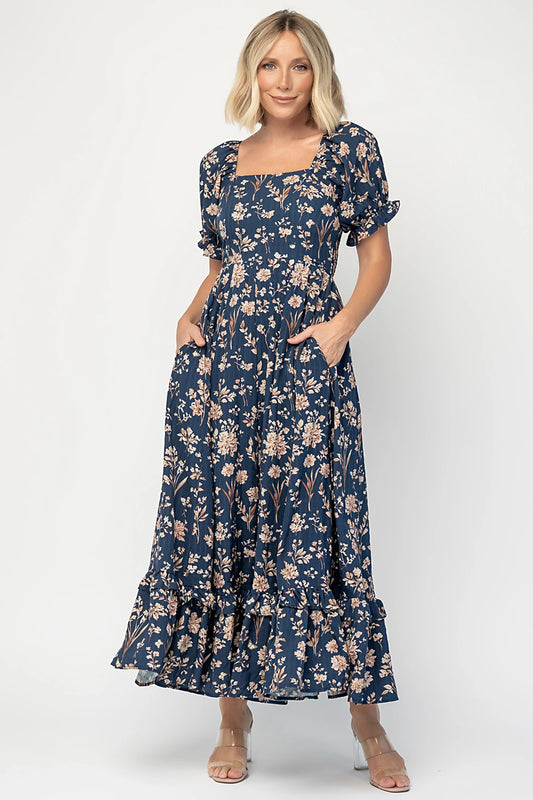 Addison Maxi Dress in Dark Blue Floral with square neckline, oversized sleeves, smocked back, and tiered ruffle skirt.