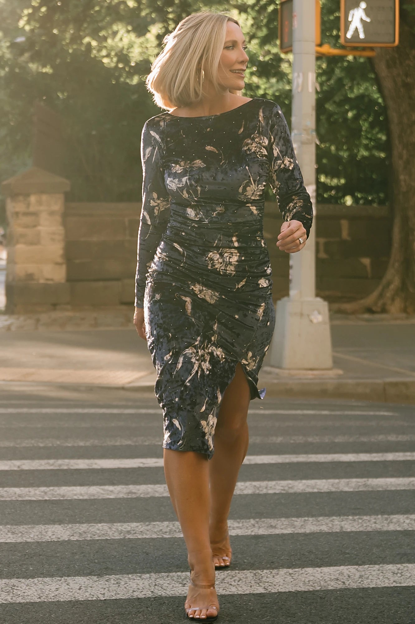 Afterglow Velvet Midi Dress in Navy + Gold with metallic florals, boat neckline, long sleeves, and side draping.