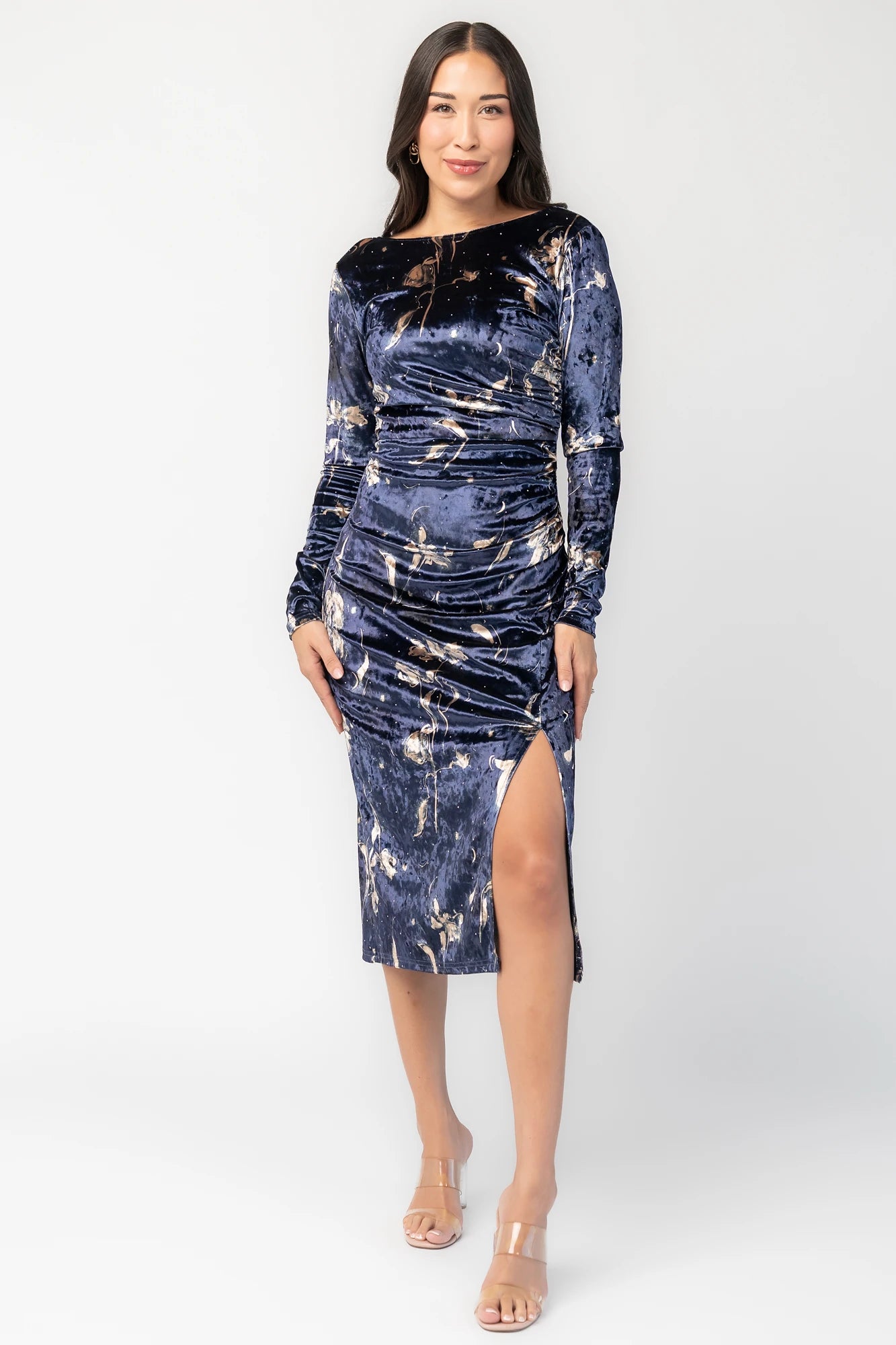 Afterglow Velvet Midi Dress in Navy + Gold with metallic florals, boat neckline, long sleeves, and side draping.