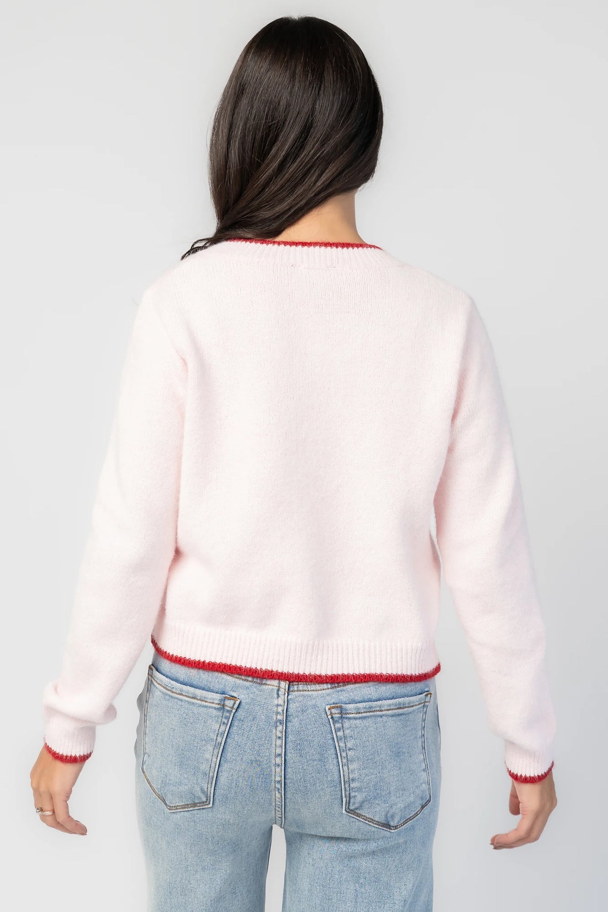Alanna Cardigan in Blush + Red with contrasting red trim, crew neckline, red button front, and ribbed knit details.