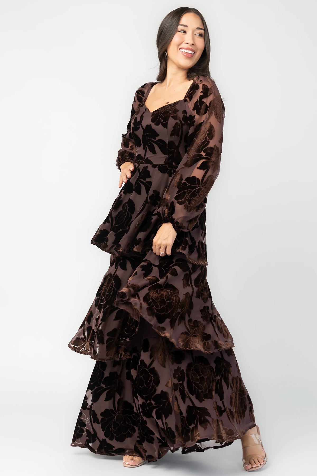 Alexandra Velvet Maxi Dress in Dark Brown with velvet florals, sweetheart neckline, long sleeves, smocked back, and flowing skirt.