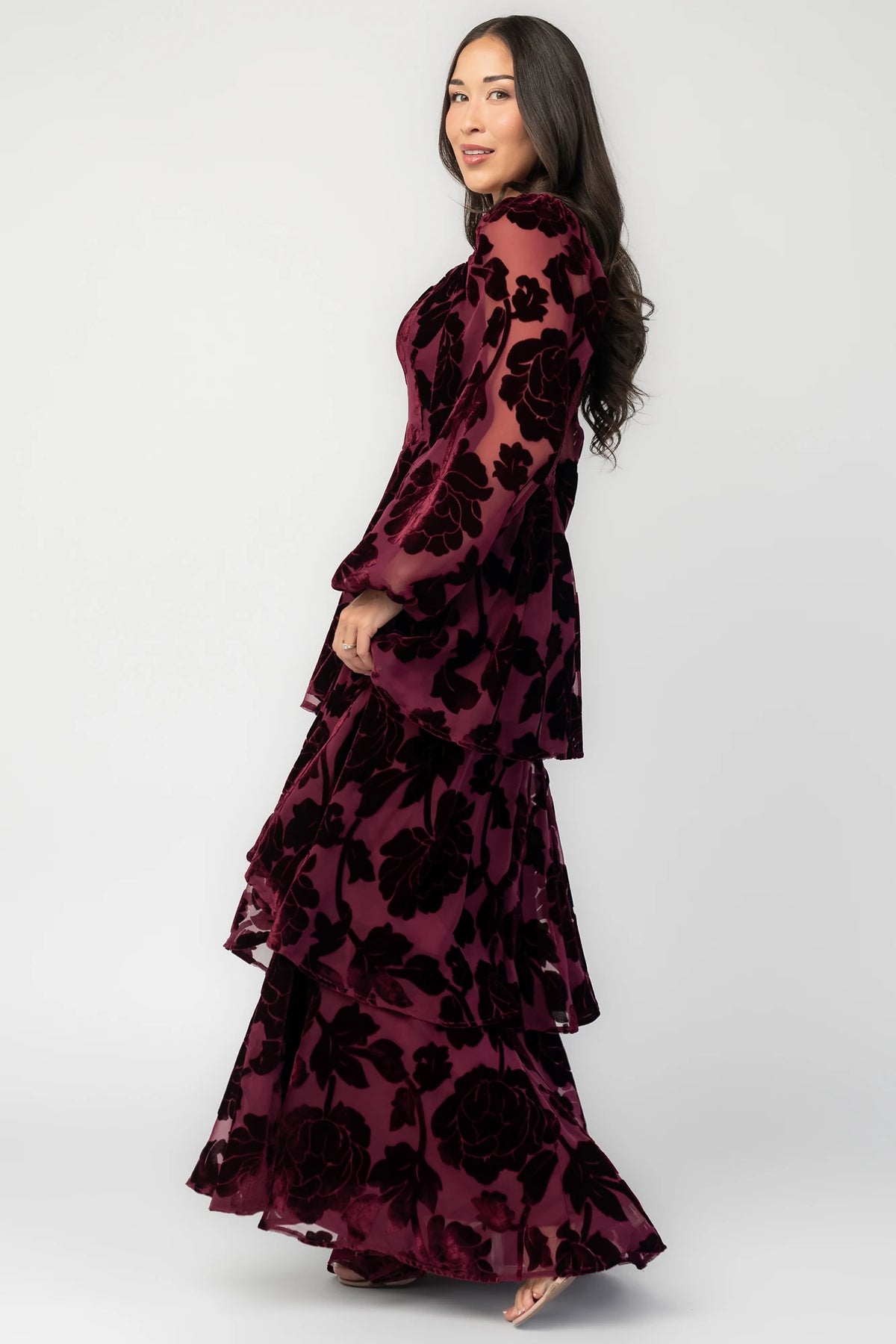 Alexandra Velvet Maxi Dress in Mulberry with velvet florals, sweetheart neckline, long sleeves, smocked back, and flowing skirt.