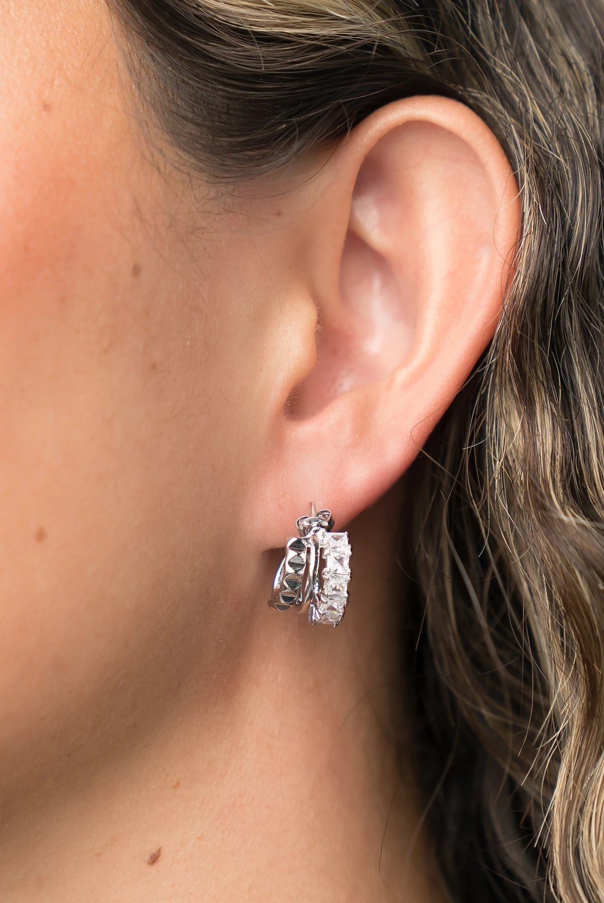 Ali Stacked Huggie Hoops in Silver with stacked design and cubic zirconia accents.
