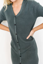 Three-quarter view of Alicia dusty jade midi dress on model, highlighting the relaxed silhouette, V-neckline, and comfortable pullover styling.