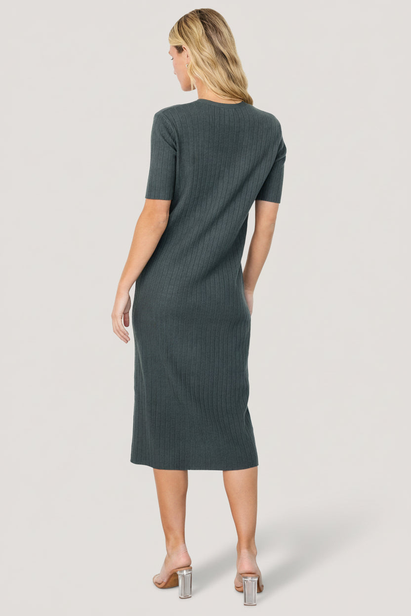 Close-up detail of the wide ribbed knit and non-functional button front on the Alicia midi dress, illustrating texture and stitch quality.