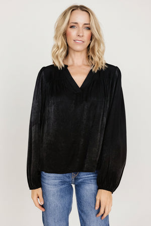 Front view of a women's black Alina blouse showing mandarin neckline, seamed bust and relaxed silhouette with wide gathered puff sleeves.