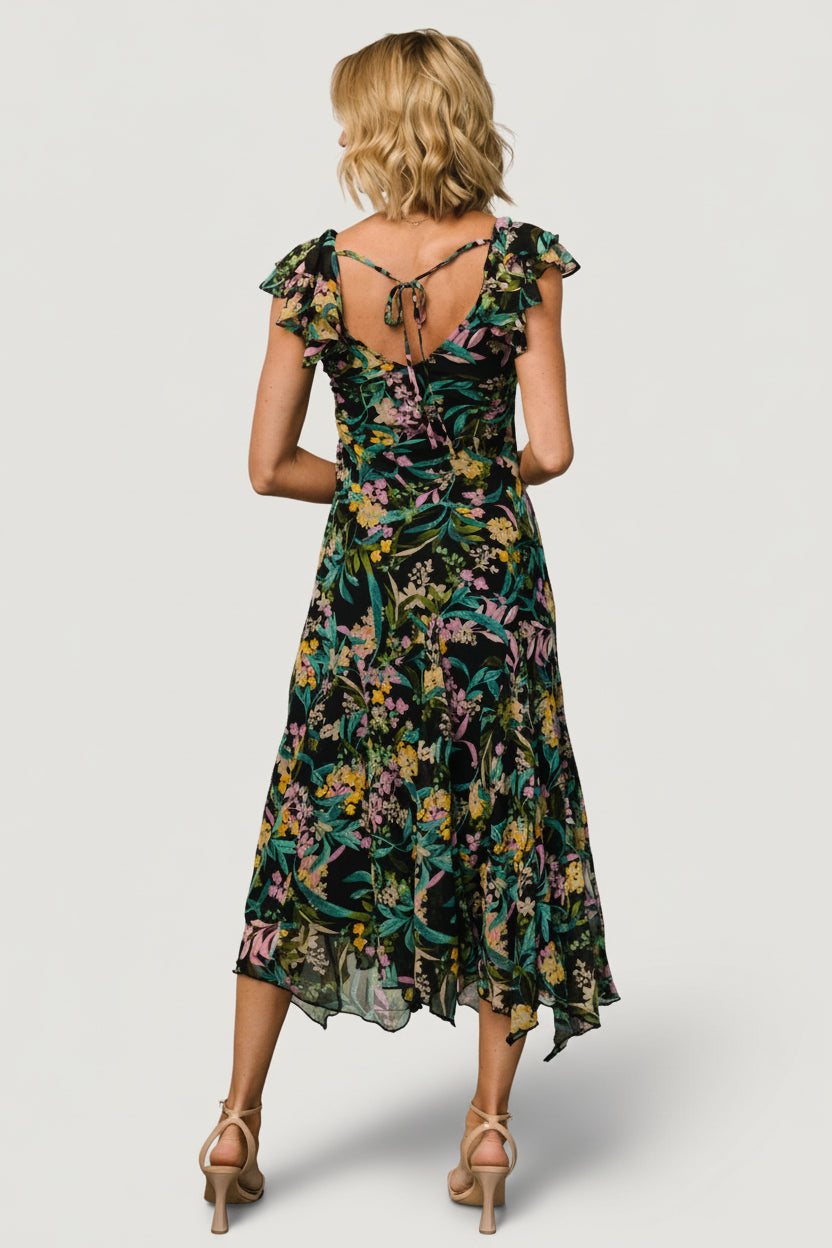 Detailed image of the V-neckline and bodice showing the chiffon texture, print contrast, and clean interior lining finish.