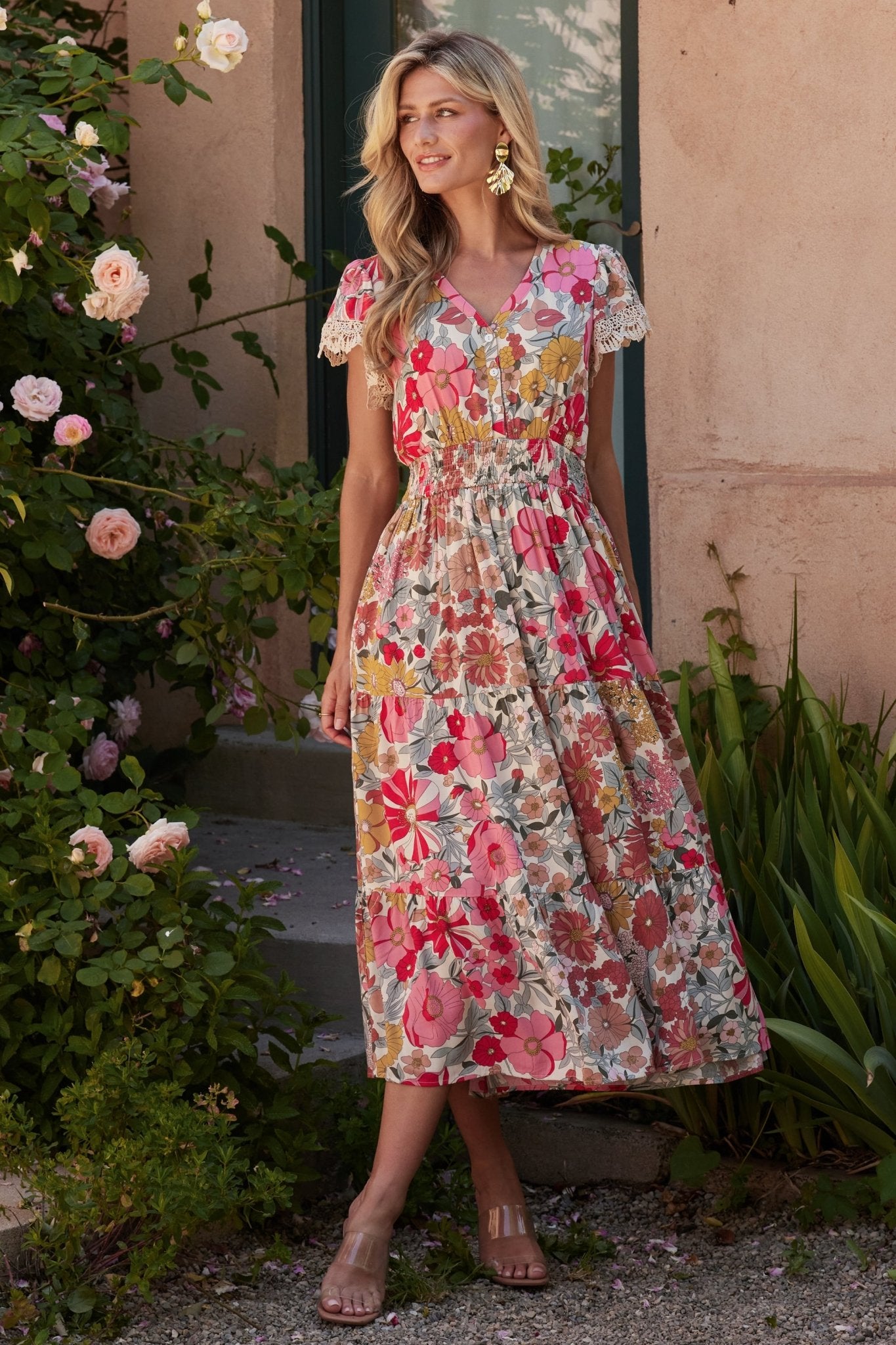Back view of Aliyah midi dress in cream multi floral showing smocked waist, partial lining and relaxed midi hemline.