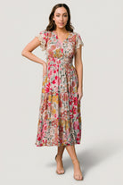 Front view of Aliyah midi dress in cream multi floral print showing V-neck, lace short sleeves, smocked waist and flowing midi skirt.