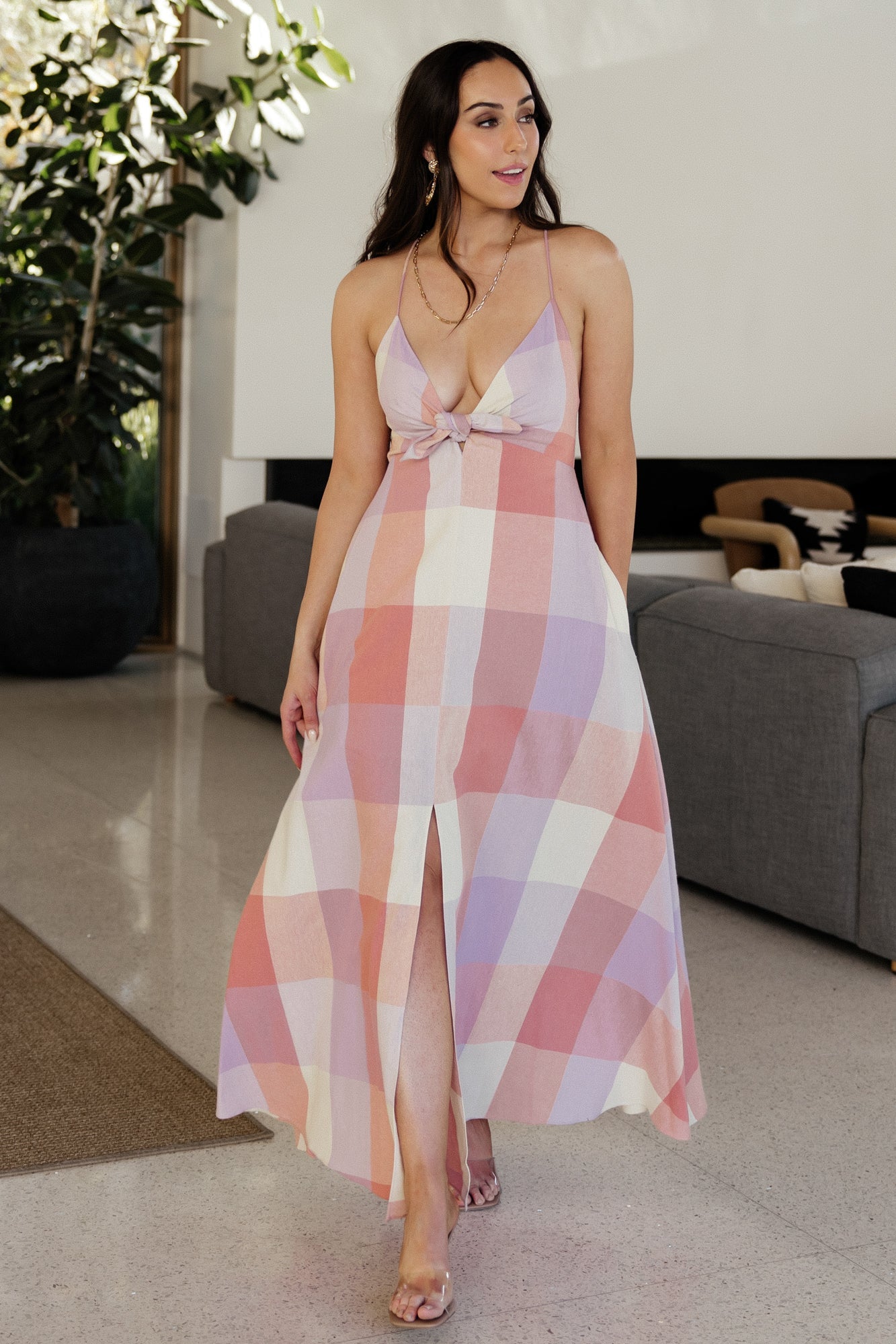 Styled shot of Ally Maxi Dress on model with wedges, showing pockets, printed skirt, and partial lining to knee.