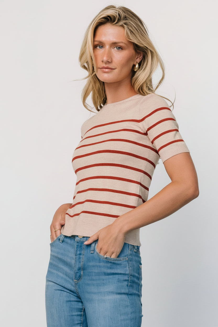 Back view of Alyson Knit Top in oatmeal and rust demonstrating fit across the back and hem length on a model with visible stripe placement.