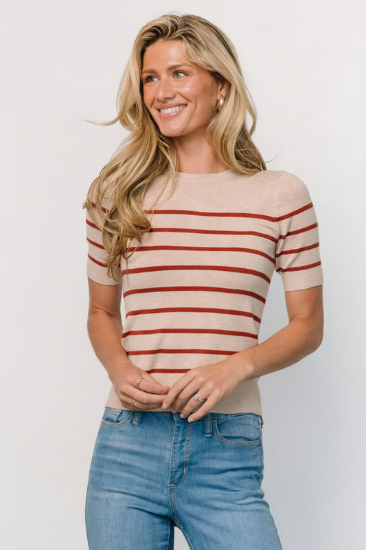 Front view of Alyson Knit Top in oatmeal and rust stripes on model; short sleeves, round neckline, lightweight viscose knit for soft drape and movement.