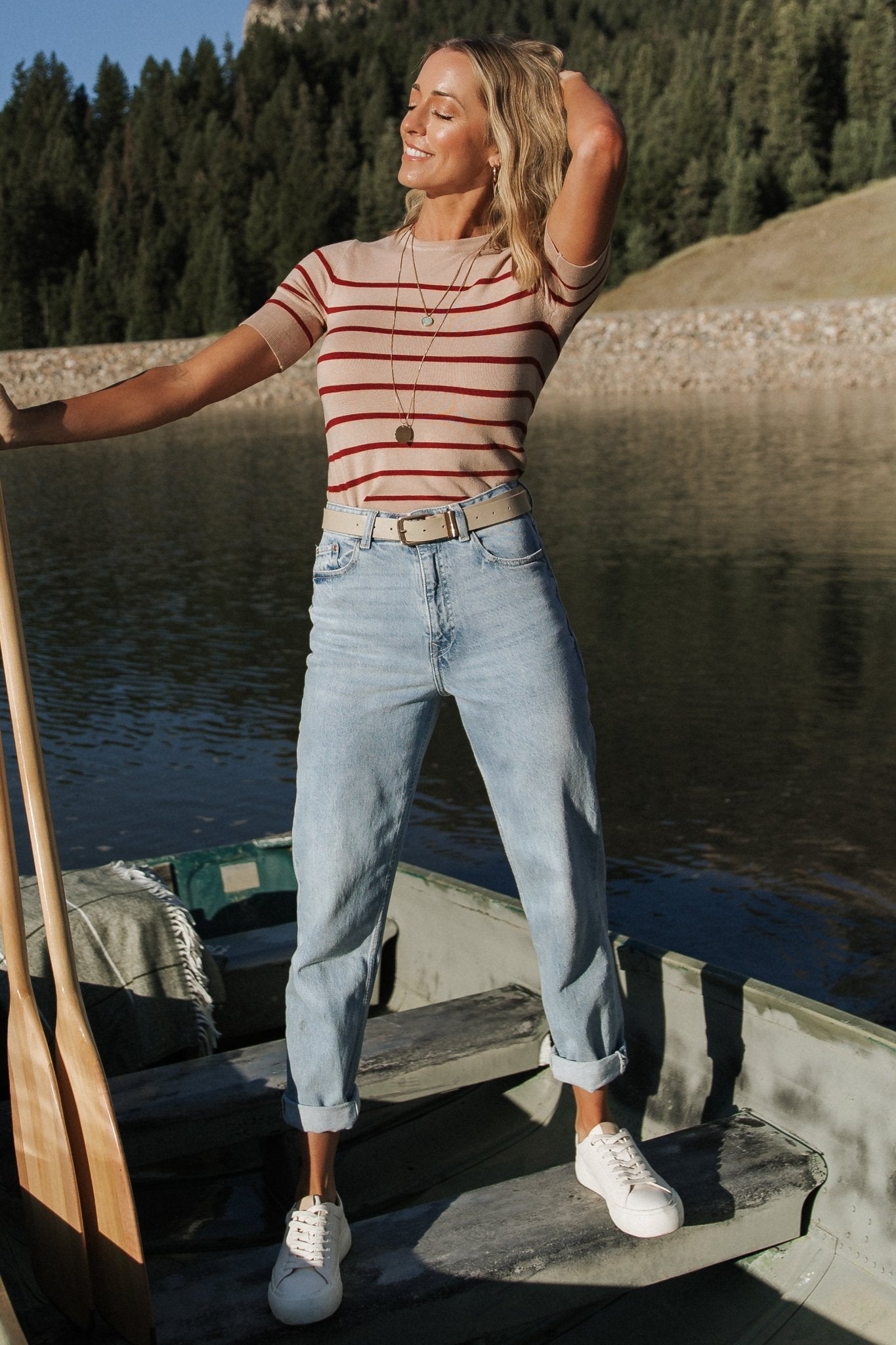 Full-length view of model wearing Alyson Knit Top paired with high-rise jeans to show length, silhouette, and casual styling options.