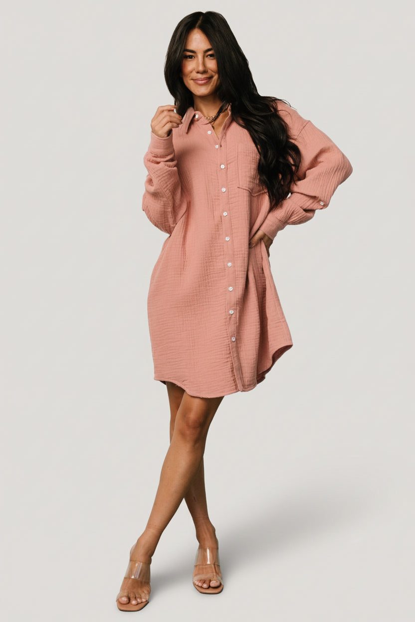 Front view of the Andres Button Shirt Dress in dusty rose showing the collared neckline, full button front, left chest pocket, and oversized silhouette.